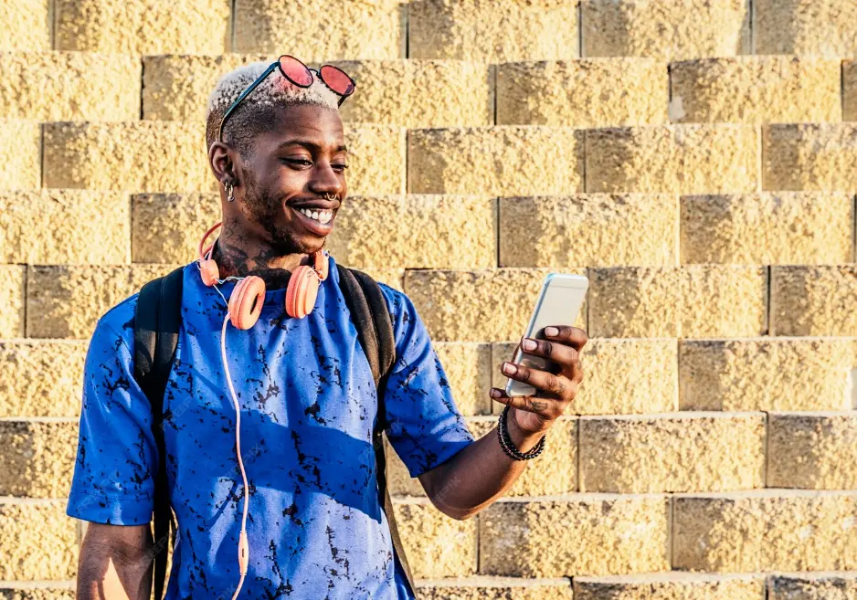 Kenyan person holding mobile phone
